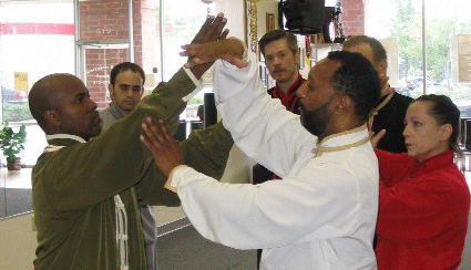 Sigung Norman Smith demonstrates push hands technique with Sifu Billy Williams.
